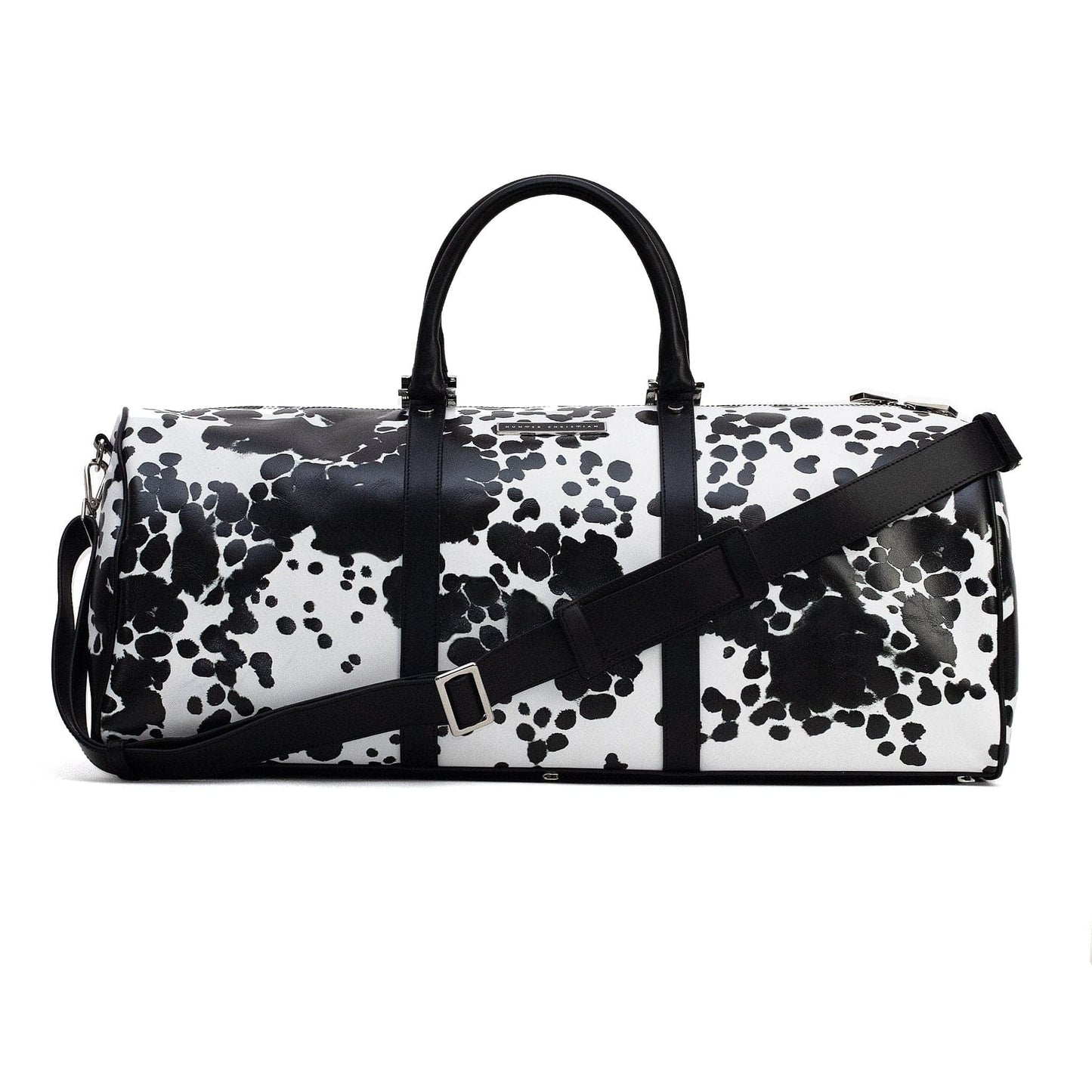 Front view of KO Leather Weekender – First Edition, crafted in black Italian leather with clean lines, graphic black and white print and structured silhouette, with detachable black leather strap