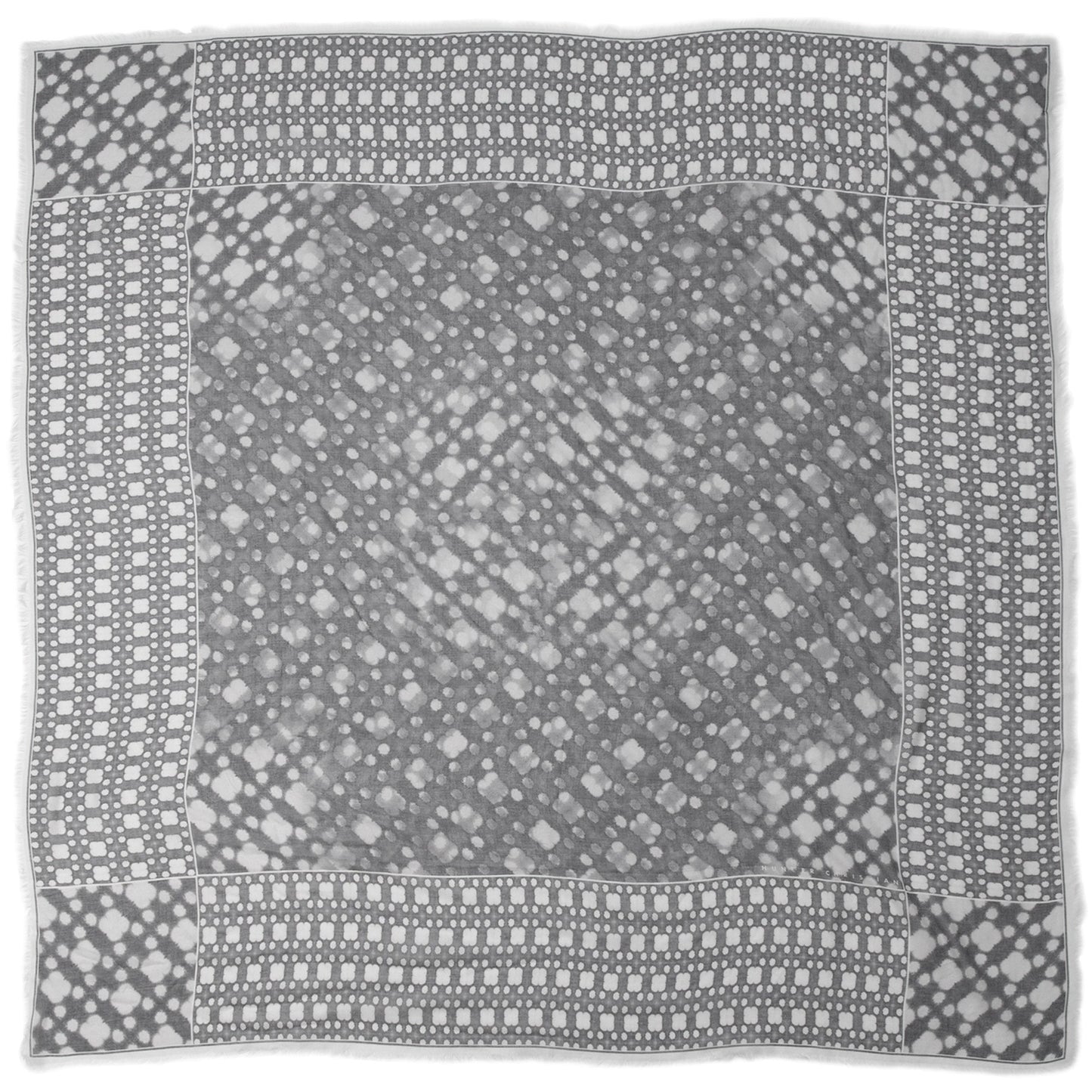 Flat lay of Aether scarf by Hunter Christian, made from lightweight Italian modal and silk, showcasing its grey-and-white abstract mist-inspired pattern.

