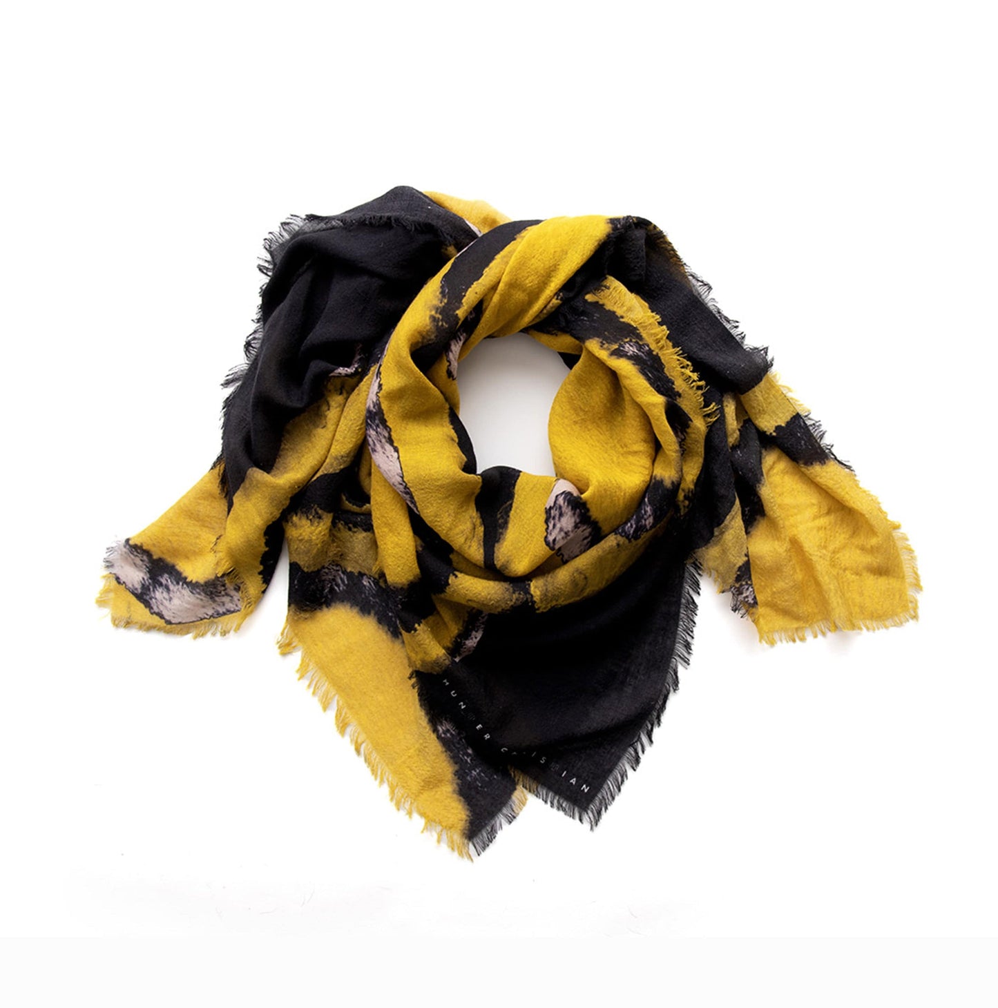 Asteria scarf coiled to highlight soft texture and sheen of Italian cashmere silk blend
