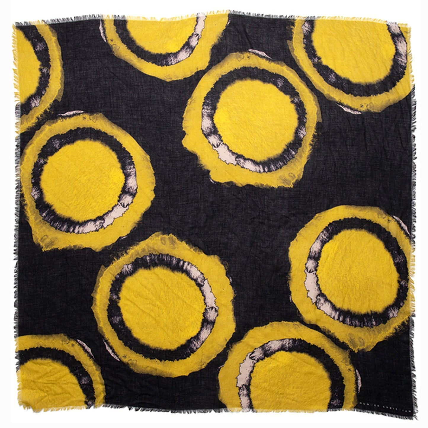 Flat lay of Asteria scarf showing full abstract celestial ring design in yellow and blush on black