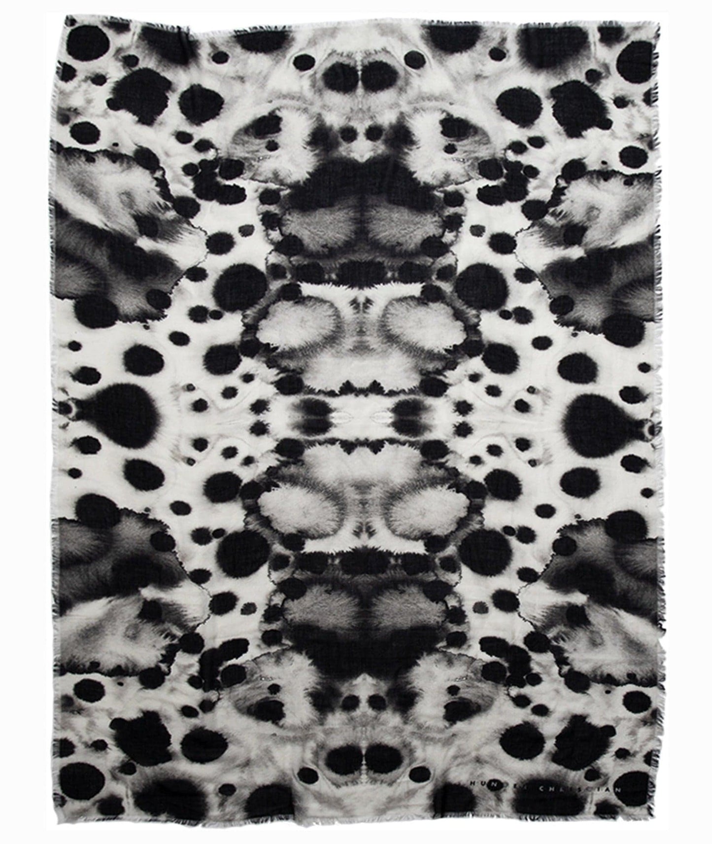 Flat lay of Hecate Scarf showing symmetrical abstract Rorschach inkblot design in black and white”