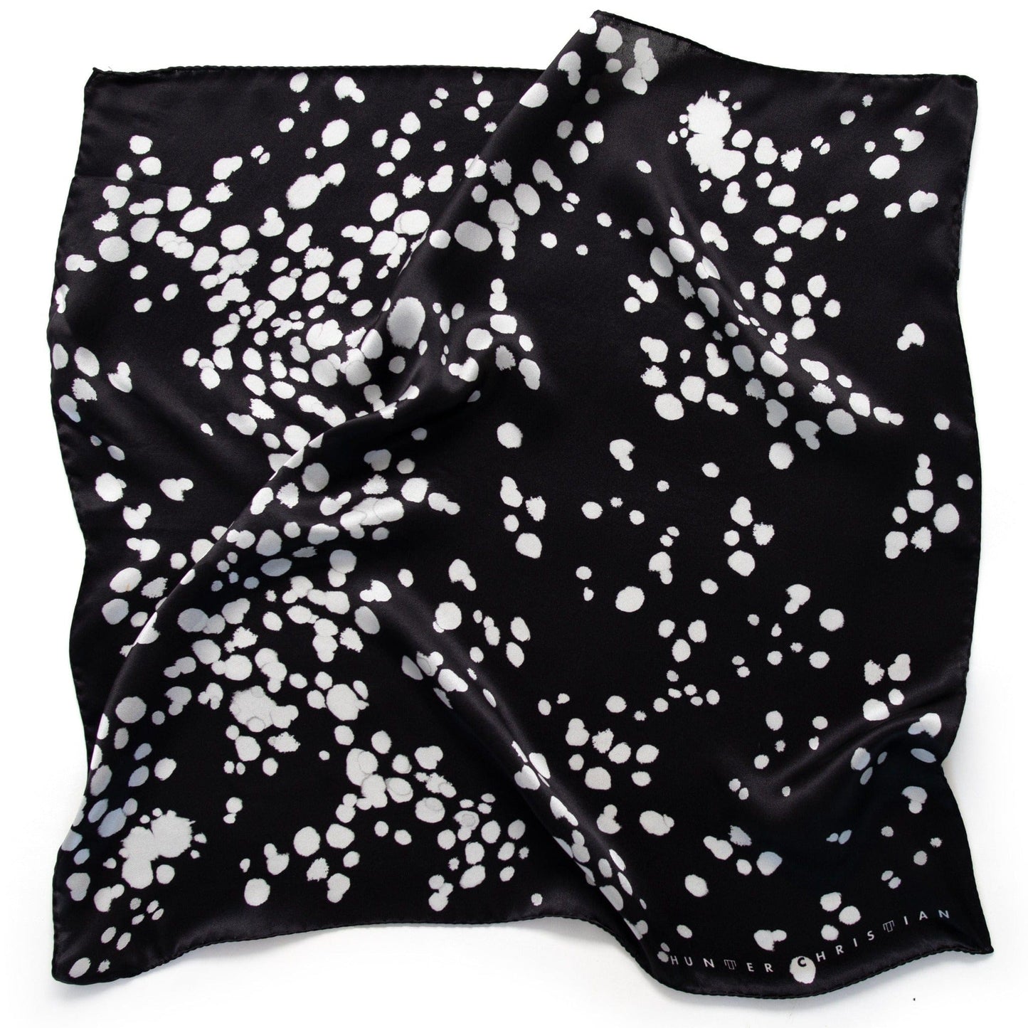 Flat lay of Ko Bandana – Absolute Inverse Edition with abstract white markings on deep black silk