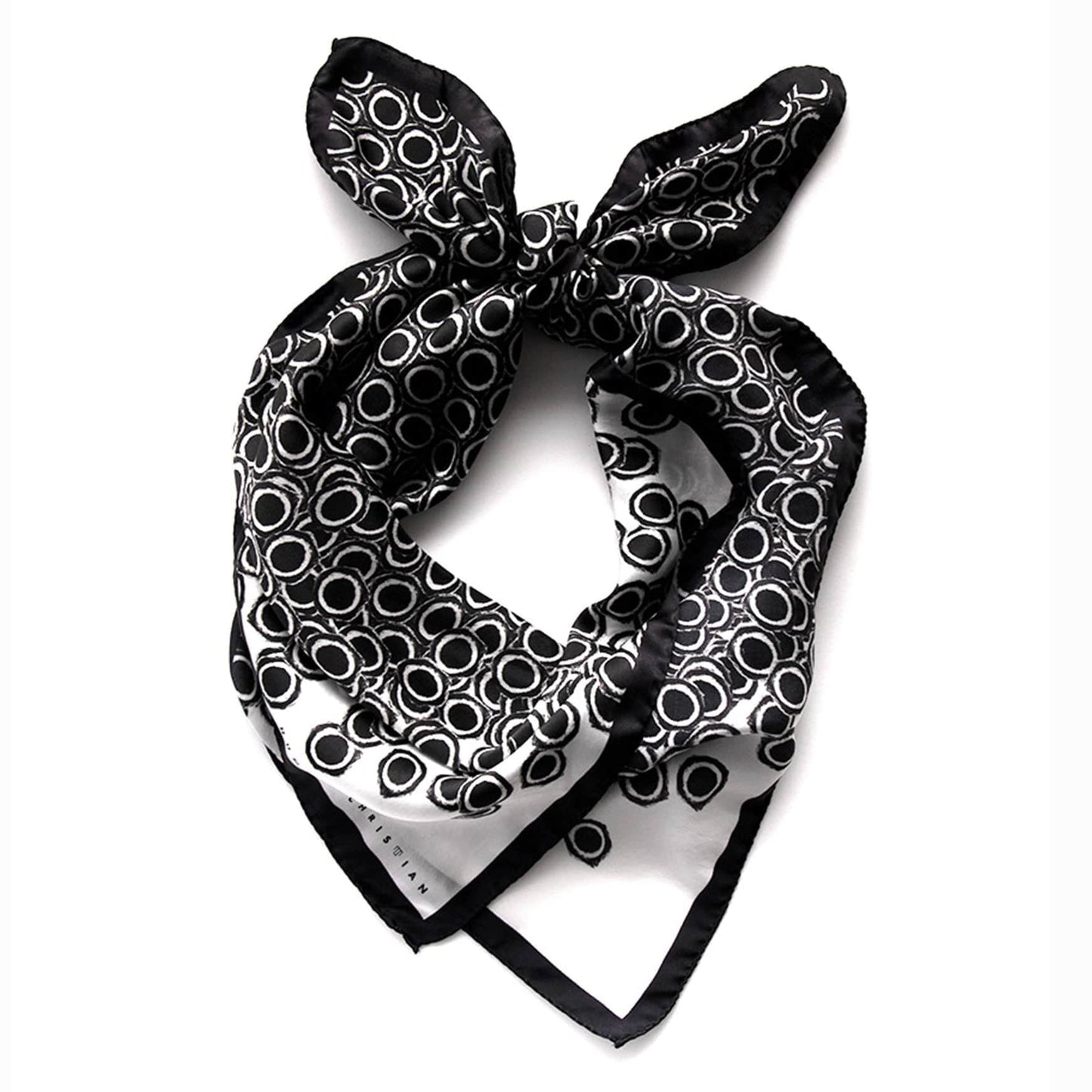 Nerites Scarf coiled to highlight lustrous satin silk texture and graphic print