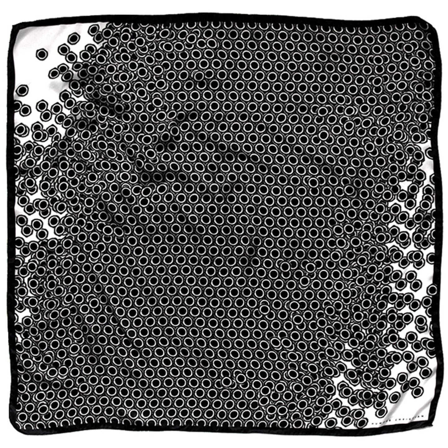 Flat lay of Nerites Scarf showing black and white abstract circle pattern with black border
