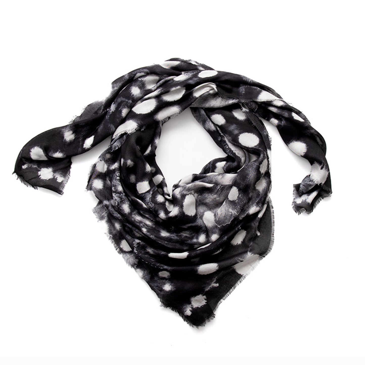 Coiled flat lay of the Nyx scarf in charcoal black vegan modal, showing the atmospheric ink-diffused print and fluid drape of this Italian-made designer accessory.